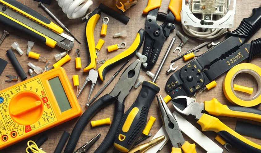 Electrical tools including wire strippers, voltage testers, and electrical tape.