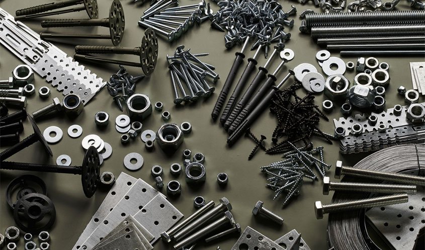 Various fasteners like nails, screws, bolts, and nuts neatly organized.