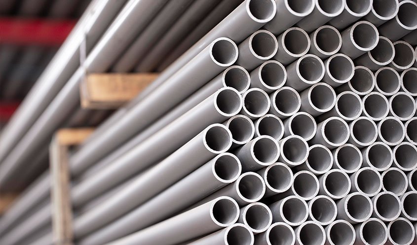 Various types of pipes including PVC, CPVC, HDPE, PPR, and galvanized pipes with fittings like elbows, tees, and couplings for plumbing applications.